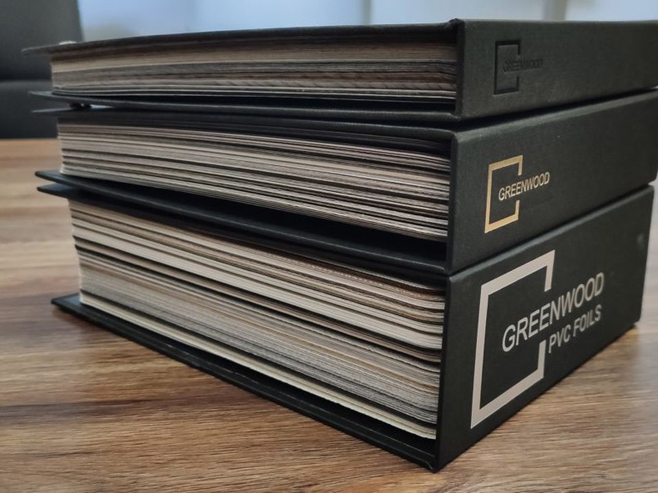 GREENWOOD PVC Foils physical sample catalogues stacked on a desk