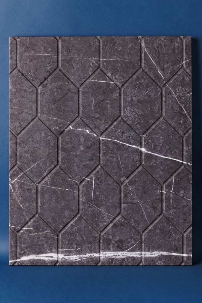 Stone-look PVC film on a hex-pattern routed decorative panel